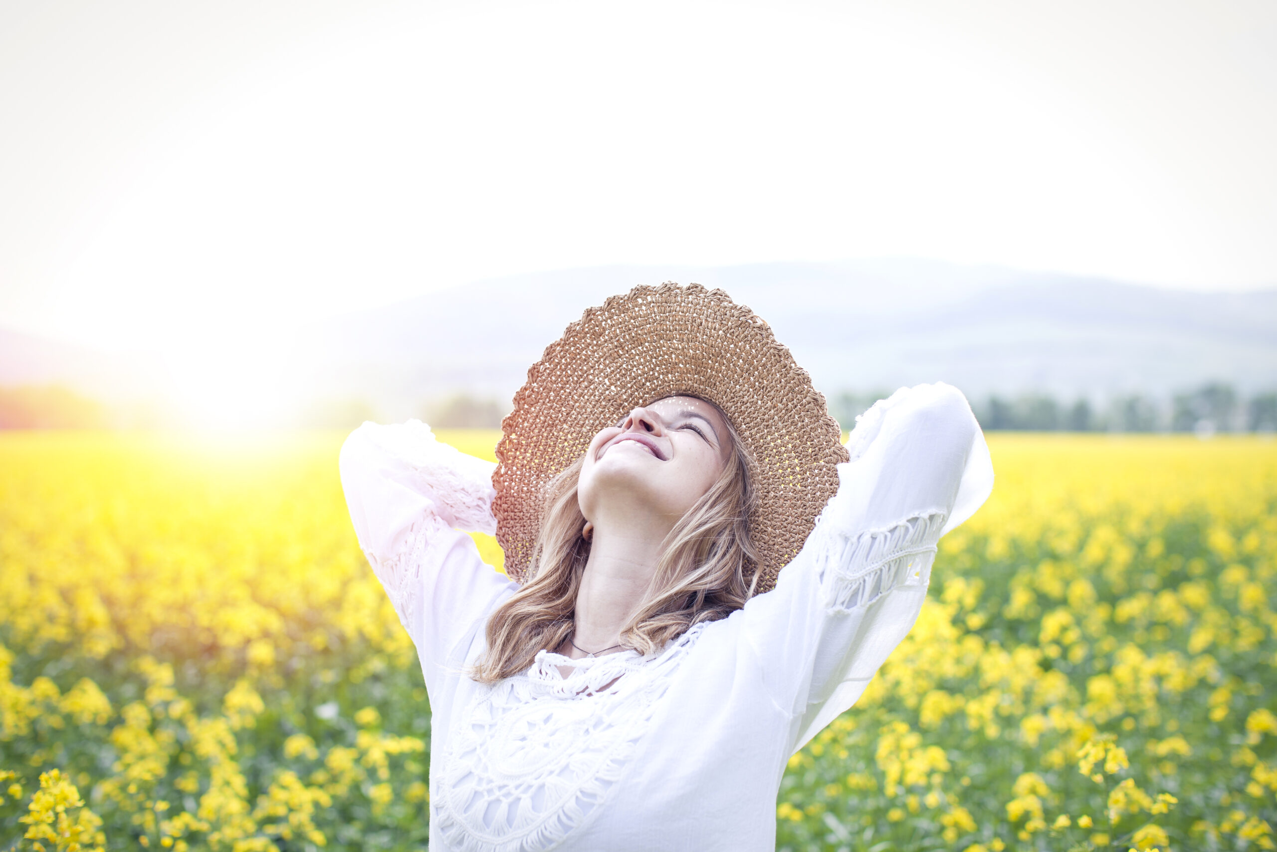 Young,woman,in,a,rapeseed,field